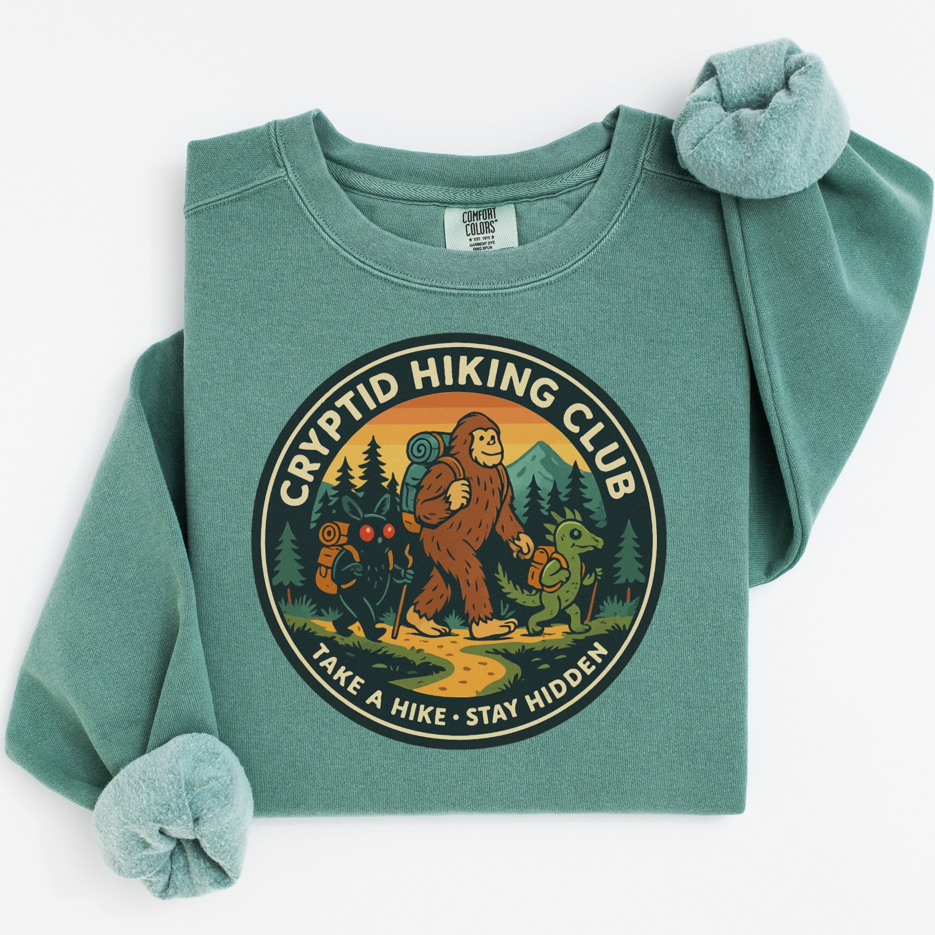 Cryptid Hiking Club Stay Hidden graphic apparel product